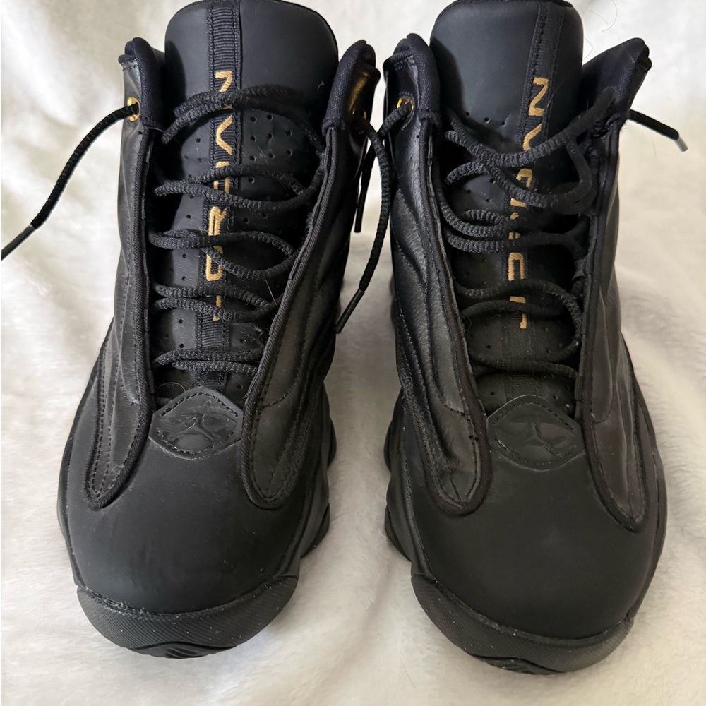 Jordan Men’s Black and Gold High-Top Sneakers